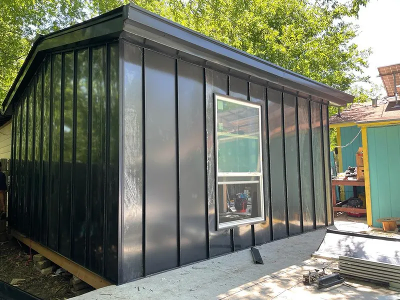 Black standing seam metal wall panels for Roof Inspection in Hermantown