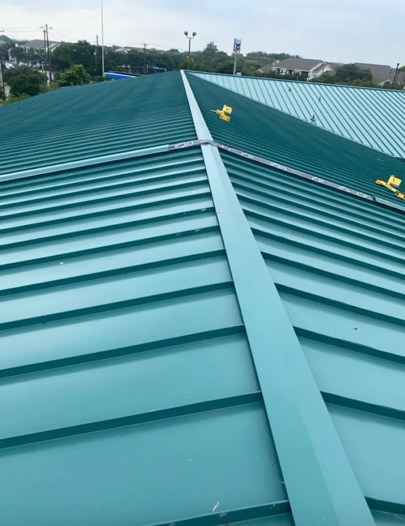 Green commercial metal roof ridge and valley for Metal Roof Repair in Hermantown