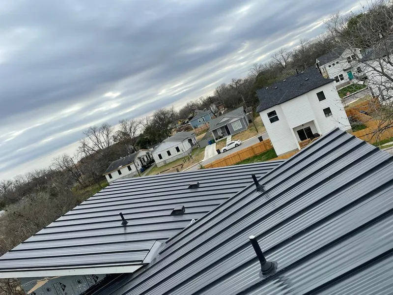 Standing seam metal roof panels with vents for Skylight Repair in Hermantown